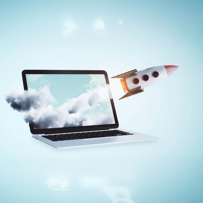 rocket shooting off from website on laptop